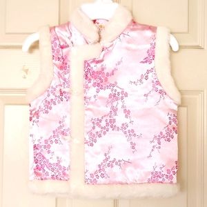NWOT. Girl's quilted vest trimed with faux fur.